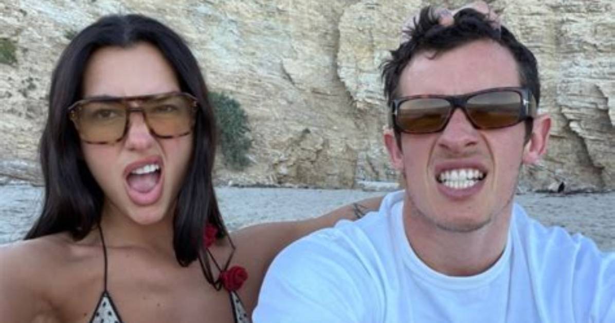 Dua Lipa Pairs a Tiny White Bikini with Fuzzy Snow Boots
