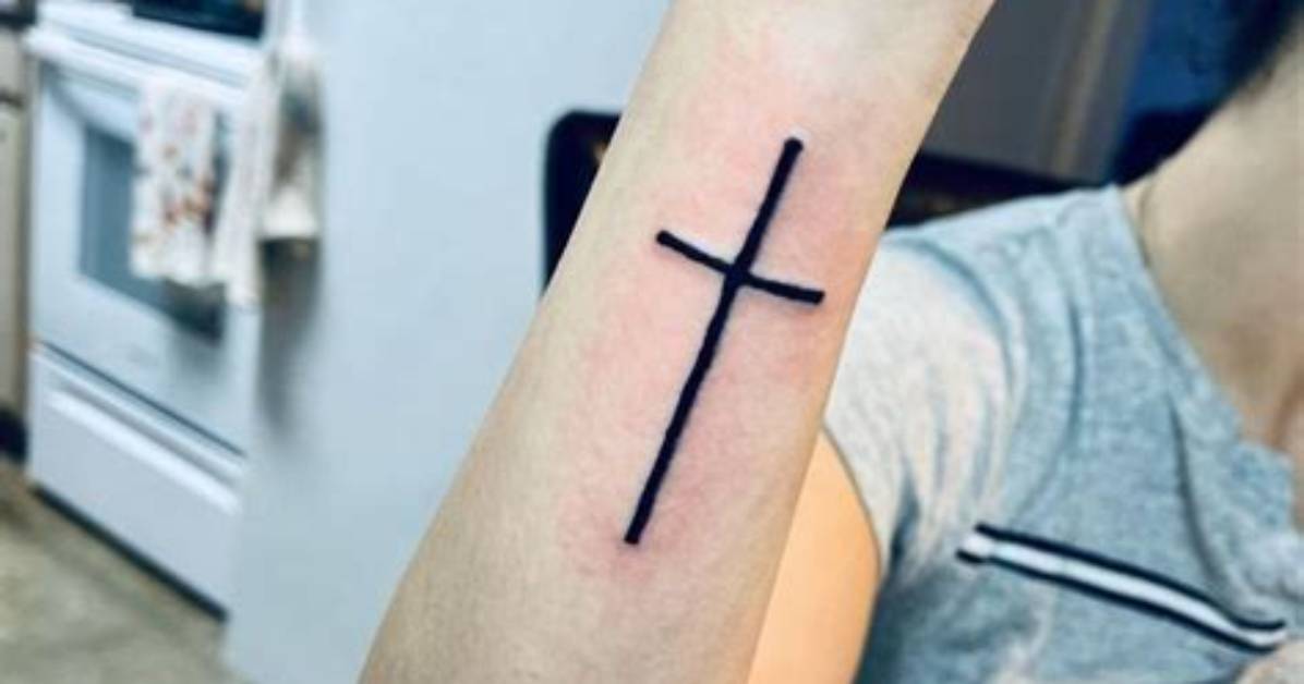 Exploring the Significance of Outer Forearm Cross Tattoos