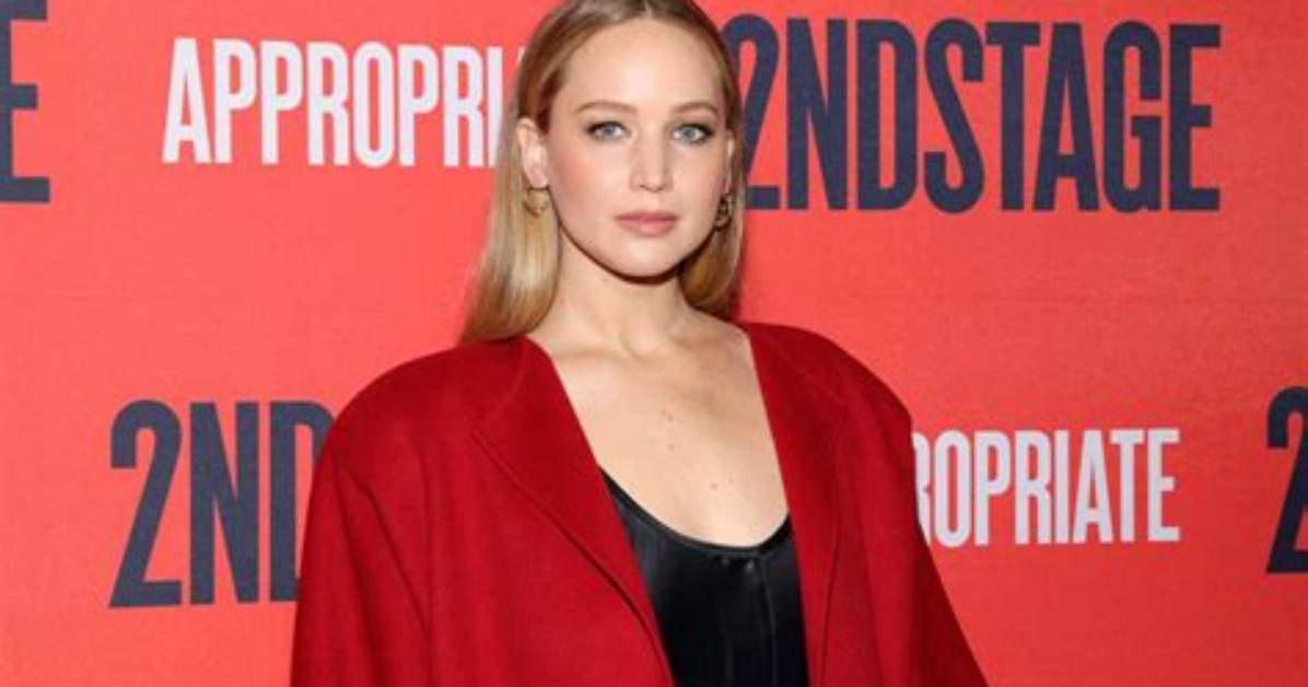Jennifer Lawrence Layered Her Enormous Crimson Red Coat over a Slinky Lbd