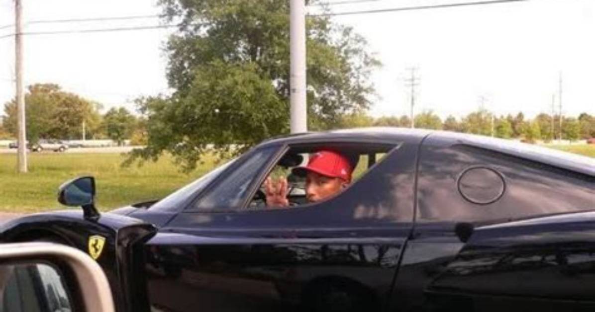 Pharrell Williams in His Black Ferrari Enzo