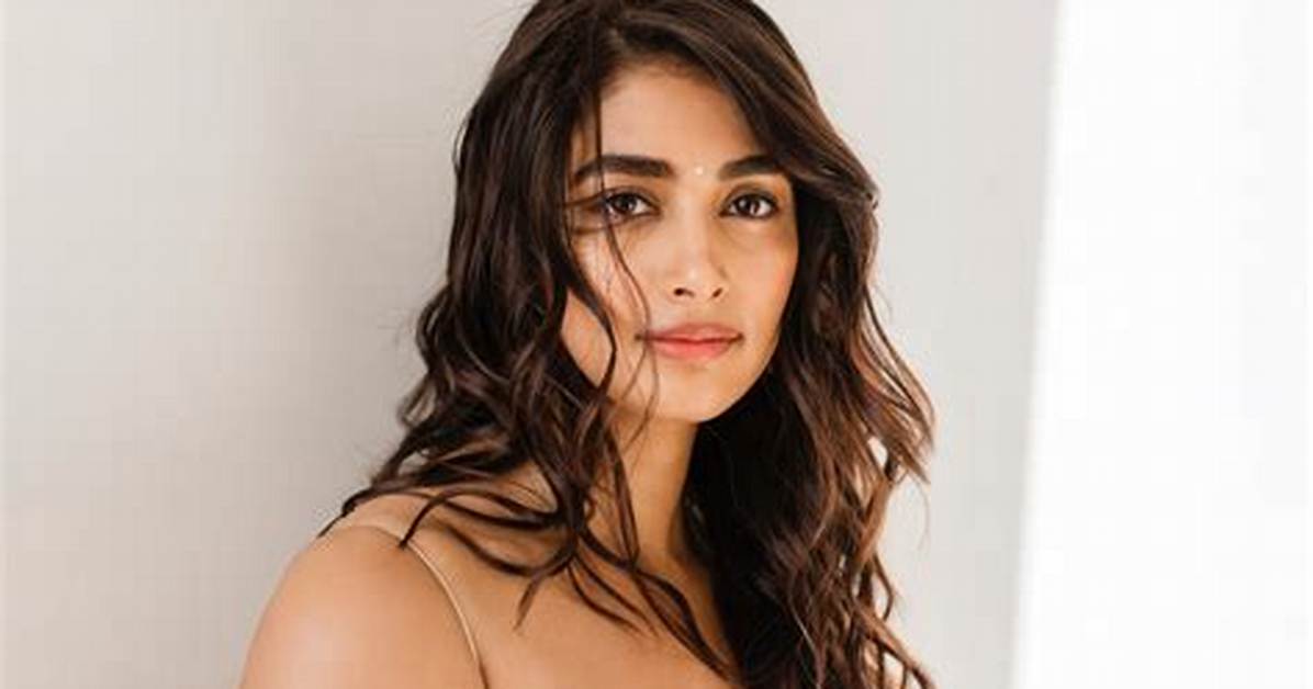 Pooja Hegde Enchants the Room in a Gleaming Nude Colored Strapless Top and Matching Skirt